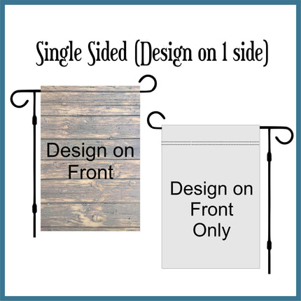Single-sided garden flag example showing a wood-look printed design on the front and a plain light gray back. Displayed on two flag stands to illustrate that the artwork appears on one side only. Helps customers see the difference between single-sided and double-sided flags.