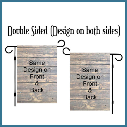 Double-sided garden flag example showing the same wood-look printed design on both the front and back. Displayed on two flag stands to show that the artwork is fully visible on each side, unlike single-sided flags. Demonstrates how double-sided printing appears when hung outside.