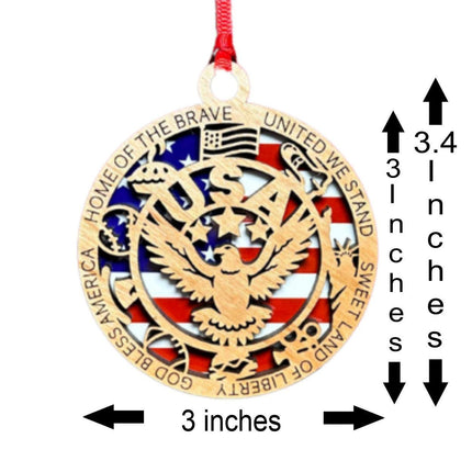 Patriotic wooden eagle ornament shown with size measurements. The ornament is 3 inches wide and approximately 3–3.4 inches tall. Features a layered American flag background with an eagle cutout and engraved border text including “Home of the Brave,” “United We Stand,” and “God Bless America.”