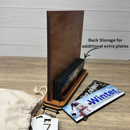 showing the back of the interchangeable wood countdown sig,n how it has storage for the extra vacation, milestone plates