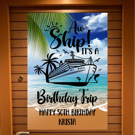 Personalized cruise door banner with a tropical beach and ocean background featuring palm trees, seagulls, and a cruise ship. The text reads “Aw Ship! It’s a Birthday Trip” with a custom message below that says “Happy 50th Birthday Krista.”